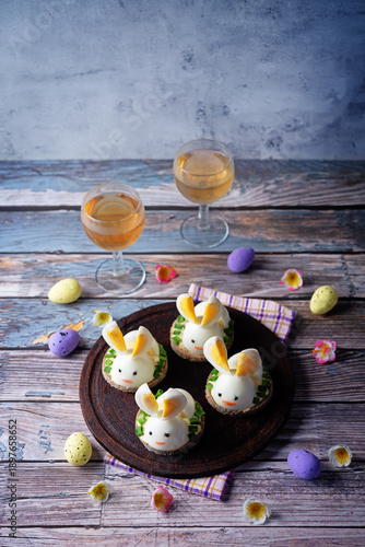 Bread with mayonnaise sauce and boiled egg in the form of rabbit in a plate for Easter holidays