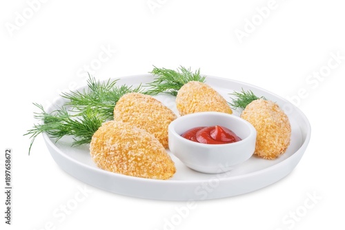 Potato croquettes in the form of carrot in a plate for Easter holidays on a white isolated background