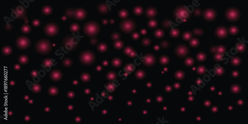 Blurry red dots on black background abstract image