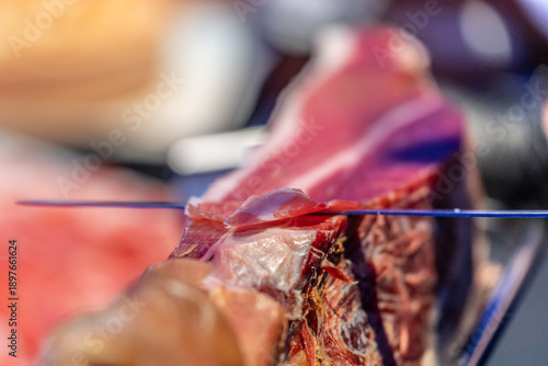 Slicing prosciutto on traditional way