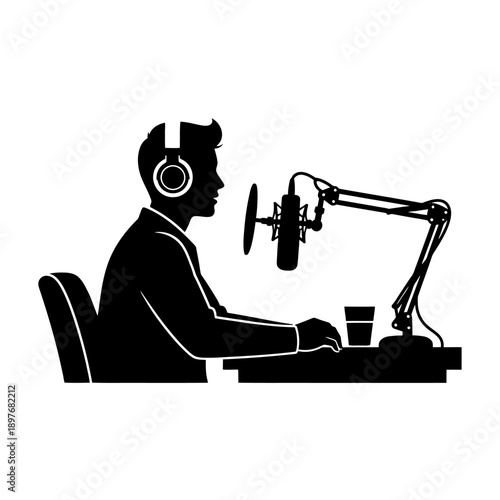 Man recording a podcast or radio show in a studio.