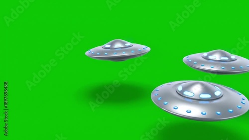 Three silver UFOs flying in formation against green background