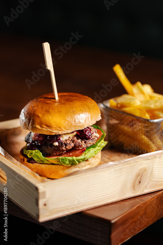 Vászonkép Gourmet beef burger with berry sauce and fresh lettuce
Juicy beef burger served