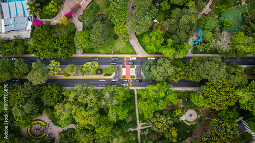 Top down drone photo of avenue crossing a large green urban park in Lima, Peru.