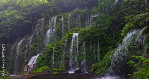 Banyu Wana Amertha Waterfall Flowing Through Lush Tropical Jungle, Bali, Indonesia