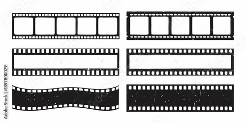 Collection of vintage filmstrips with sprocket holes isolated on white