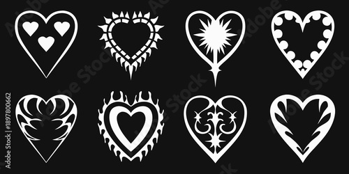 Variety of stylized white hearts against a solid black background