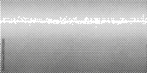 A grainy monochrome gradient transitioning from dark to light pixels