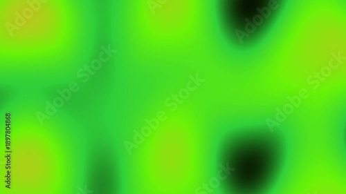 A dynamic and ethereal abstract motion background showcasing fluid transitions between brilliant green and yellow hues, with softer dark areas creating depth. The luminous colors gently shift and morp