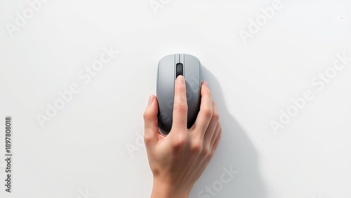 Top view of a human hand using a modern gray wireless computer mouse isolated white background concept