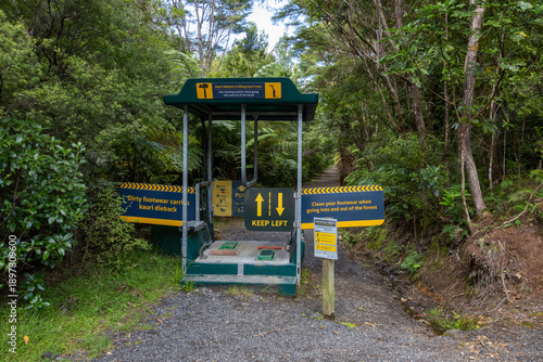 Footwear cleaning station in New Zealand, to prevent the spread of Kauri dieback disease, which is killing Kauri trees.  Broken Hills, Hikuai, Coromandel Peninsula, New Zealand.