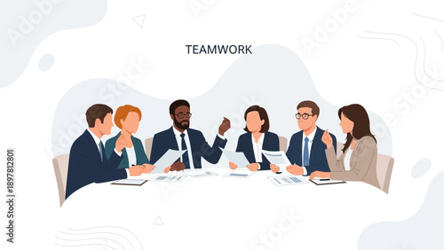 Diverse business team collaborating around a table, discussing documents and ideas.