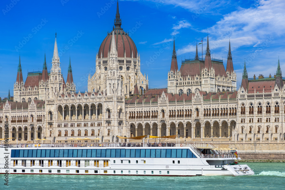 Obraz premium Hungary, boat cruise on Danube River near Budapest Parliament. Panoramic view of city skyline of Budapest historic center