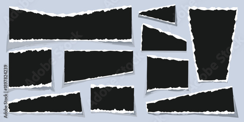 Collection of torn black paper pieces with white edges on a light background