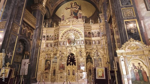 Richly decorated golden altar within the sacred interior of Domnița Bălașa Church.