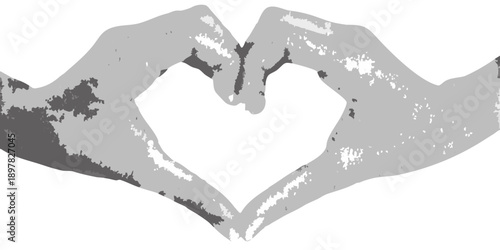 Two hands forming a heart shape against a dark background