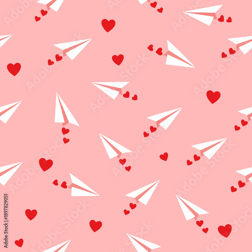 A charming pattern of paper airplanes and hearts on pink background.