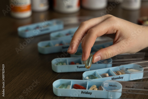 Organizing weekly medication in pill boxes for daily consumption by a person at home during morning hours
