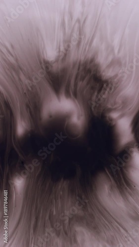 Vertical video. Paint splatter. Blur wet texture. Defocused black dark water liquid fluid blotch spilling on abstract white art background.