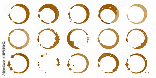Arrangement of coffee ring stains in a grid pattern on a white background