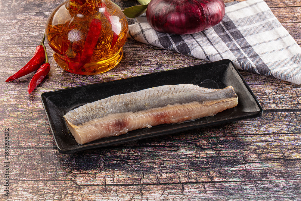 Fototapeta premium Marinated pickled salted herring fillet