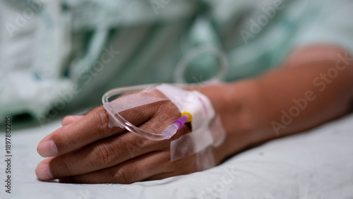 Close up of patient hand with intravenous iv drip, focusing on medical treatment, hospital healthcare, illness recovery, and clinic nursing care