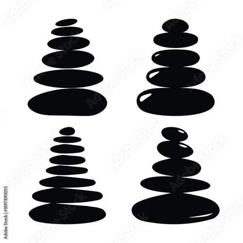 Four balanced zen stone stacks illustrating peace, harmony, and tranquility
