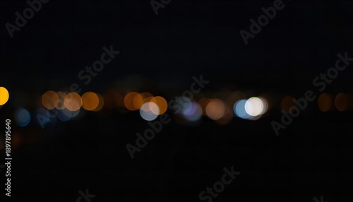 A blurry nighttime cityscape with colorful lights against a dark background