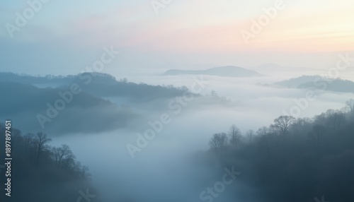 Wallpaper Mural Misty Mountain Landscape at Sunrise with Soft Pastel Sky Over Rolling Hills Covered in Trees and Fog Torontodigital.ca