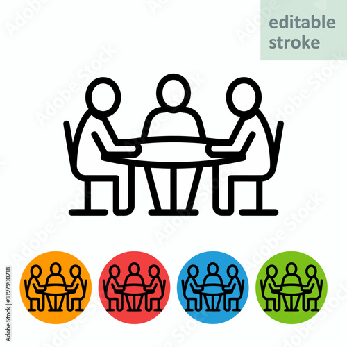 People sitting at a meeting table.