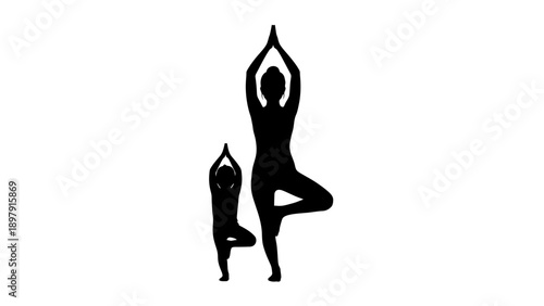Silhouette of a woman and child practicing yoga together in a serene pose.