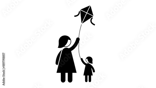 Mother and child flying a kite outdoors.