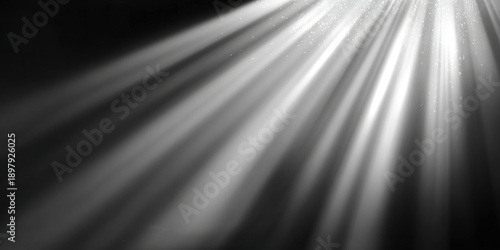 A dramatic interplay of light beams illuminating particles in a dark space, creating a captivating and ethereal atmosphere.