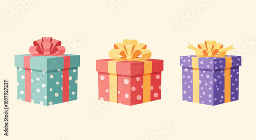 Three polka-dotted gift boxes with bows sit on a plain background