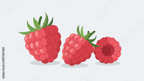 Three red raspberries with green leaves arranged on a light grey background
