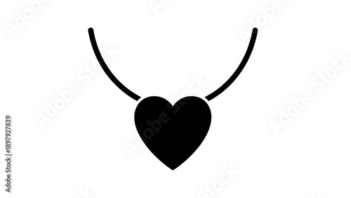 Simple black heart shaped pendant on a necklace.
