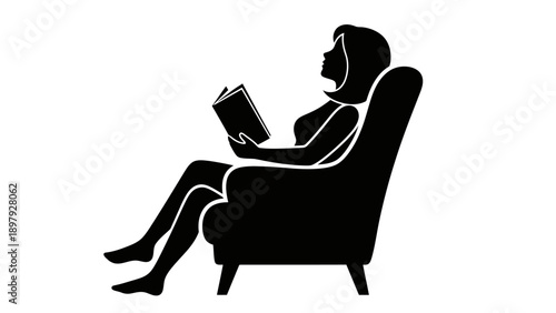 Woman Relaxing in Chair Reading a Book.
