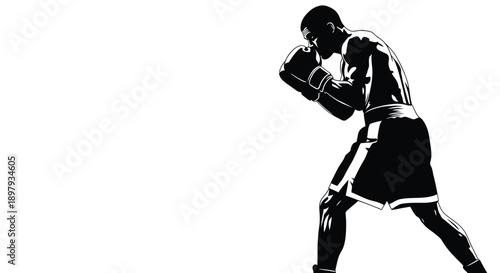 Powerful black and white silhouette of a boxer holding a fighting stance ready to attack
