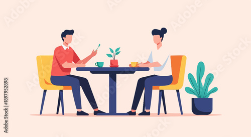 Two people sit at a table drinking