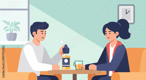 Two people sit on couches, sharing a table with drinks and a bottle