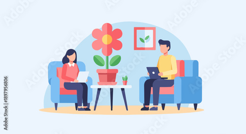 Two people sitting on couches, using laptops in a room with a flower