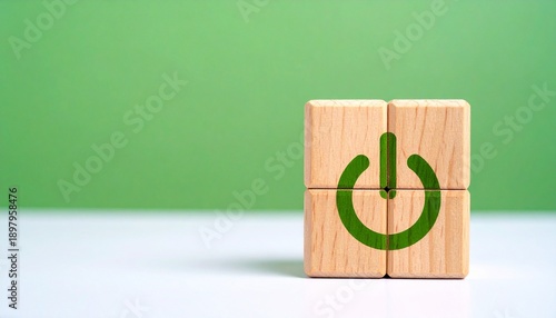 Green power symbol formed by wooden blocks.