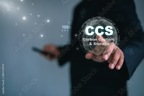 Fotografie Business professional interacting with CCS carbon capture and storage technology interface,representing climate change mitigation,carbon reduction,clean energy innovation,sustainable global solutions