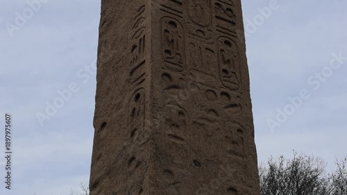 tall egyptian obelisk with heiroglyphics in central park manhattan new york city (historic antique monument from ancient egypt) art history relic thousands years old museum mile metropolitan