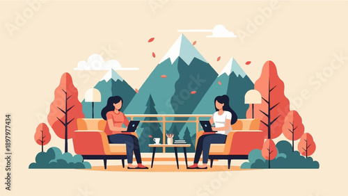 Two women work on laptops on a balcony with mountains and colorful trees