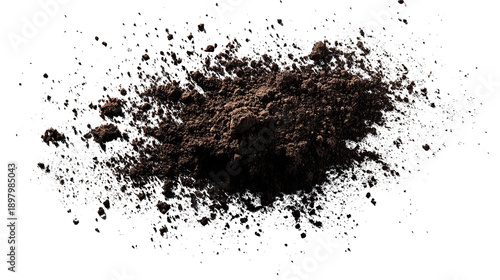 Heap of dark brown powder against a black background with scattered sparkles around it