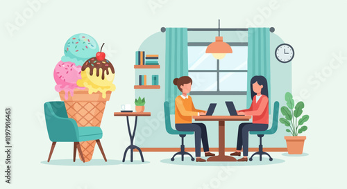 Two women working on laptops next to a giant ice cream cone