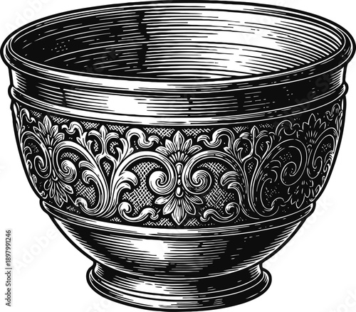 Ornate vintage bowl with detailed floral and swirl pattern engraved in metal craftsmanship