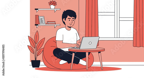 Young man working on laptop while sitting comfortably on a beanbag chair at home