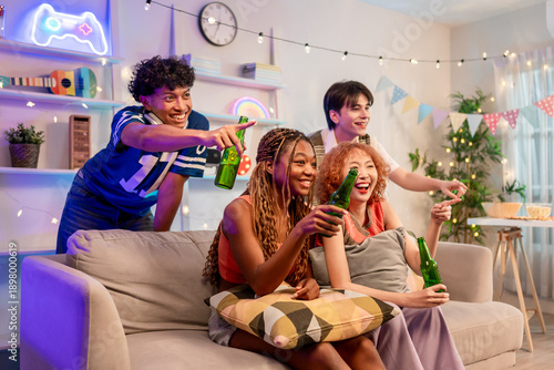 Group of diverse Generation Z friends enjoying a party in a cozy house.